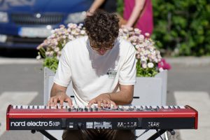 musician, boy, keyboard, pianist, busker, playing, electronic, piano, street, public place, entertainment, musical